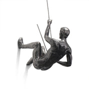climbing man wall sculpture
