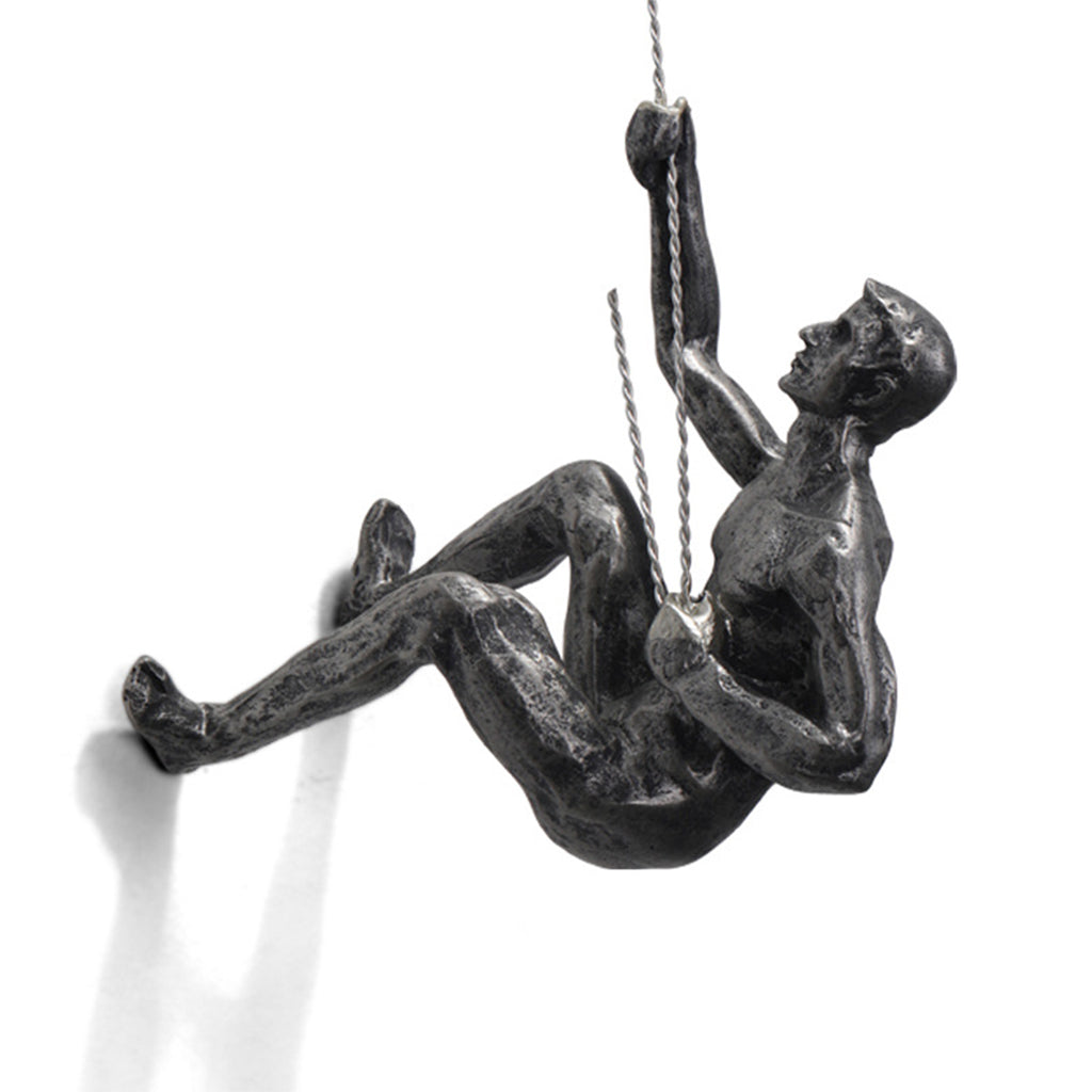 climbing man wall sculpture