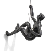 climbing man wall sculpture