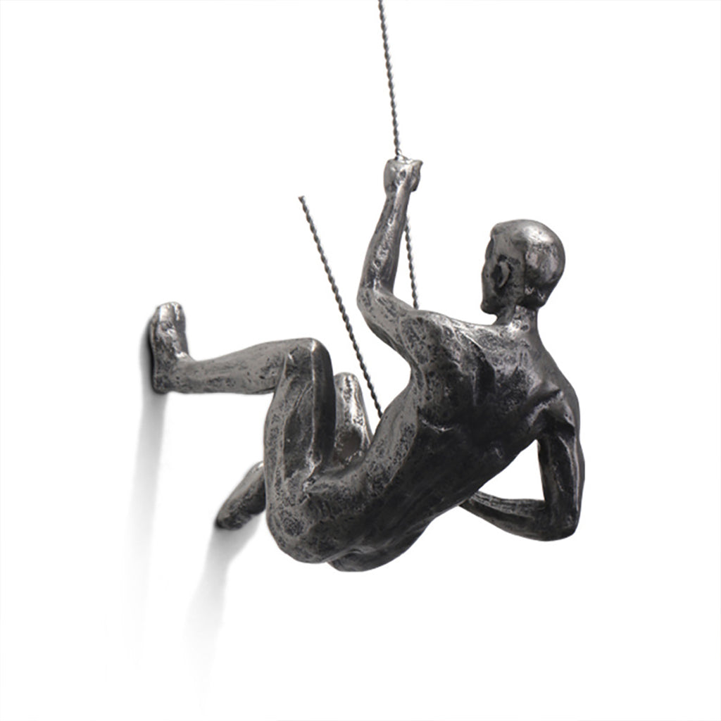 climbing man wall sculpture