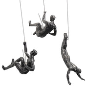 climbing man wall sculpture