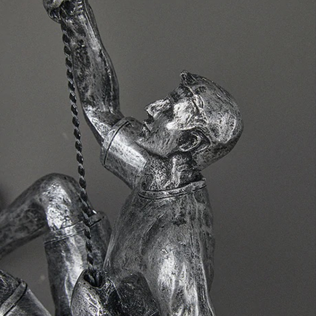 climbing man wall sculpture