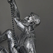 climbing man wall sculpture