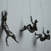 climbing man wall sculpture